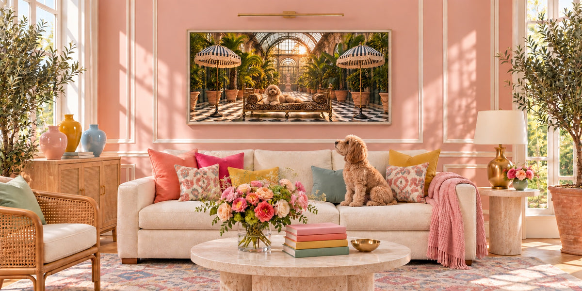 L'Orangerie canvas above a sofa in a pink living room, with Cash the poodle looking up at his portrait