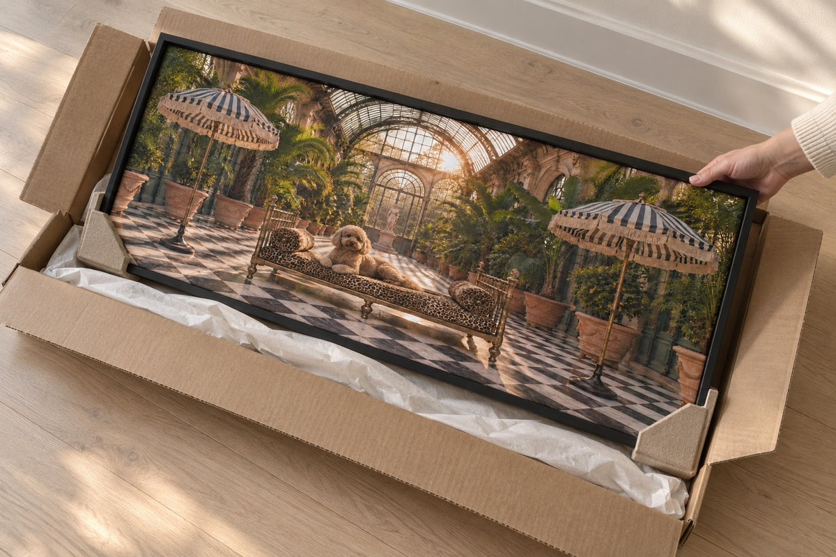A framed canvas lifted from a flat kraft carton with corner protectors still fitted