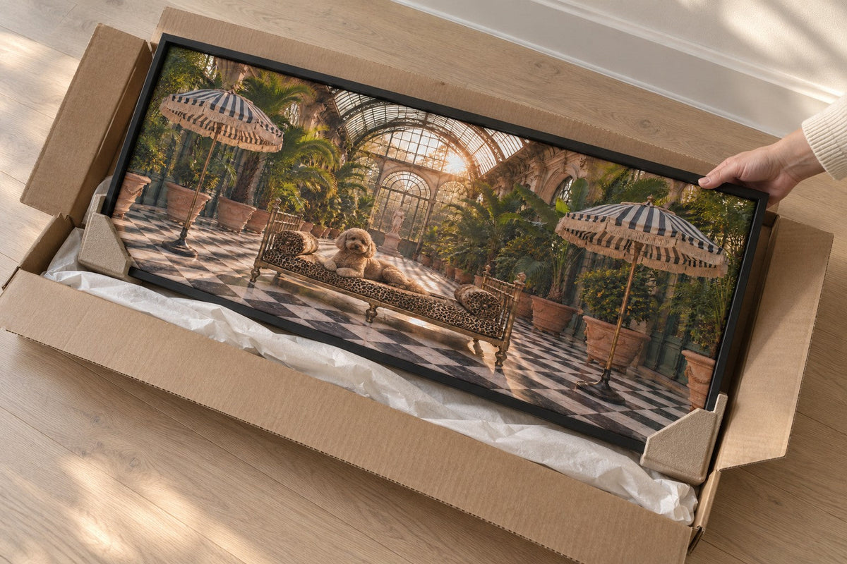 A framed canvas lifted from its flat kraft carton, corner protectors still fitted